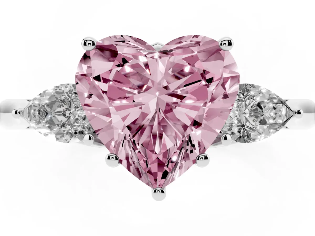 Fancy Pink Three-Stone Heart Cut Brilliant Diamond Solitaire Ring with Tapered Band and Four-Prong Setting White gold