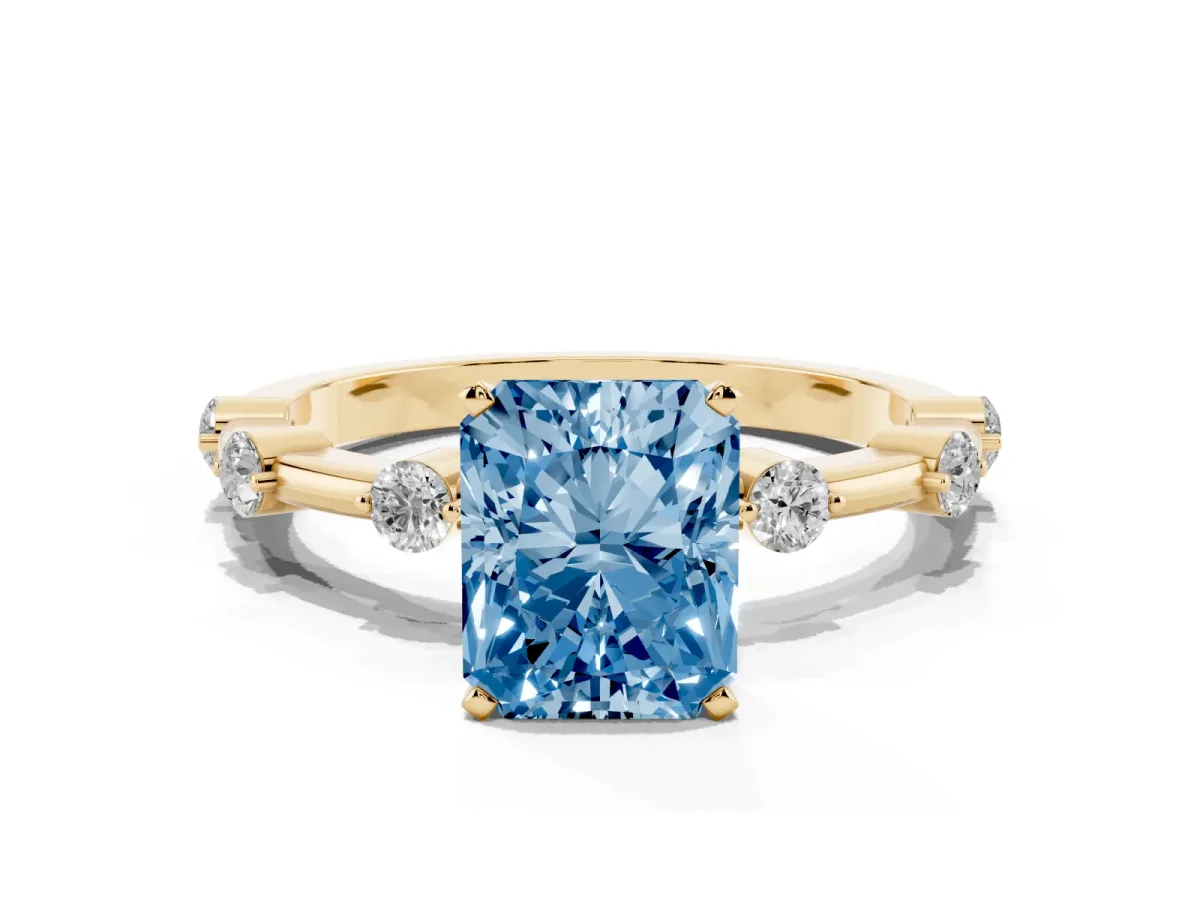 Fancy Blue Radiant Cut Solitaire Diamond Ring with Bezel Set Side Stones and Prong Setting Yellow gold