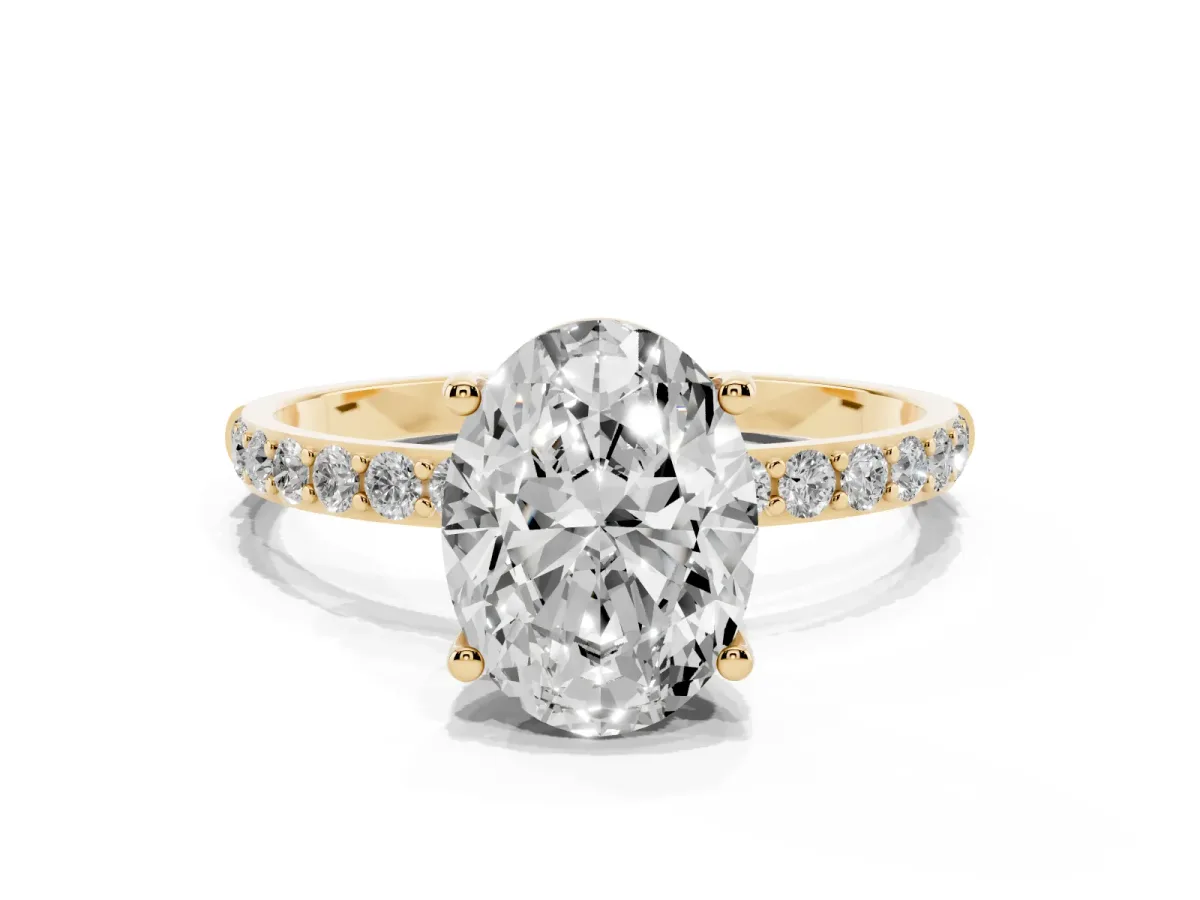 Oval Cut Diamond Solitaire Ring with Round Pavé Shoulders and Prong Setting Yellow gold