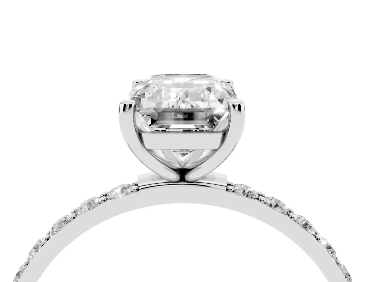 Emerald Cut Diamond Solitaire Ring with Round Pavé Shoulders and Prong Setting Silver