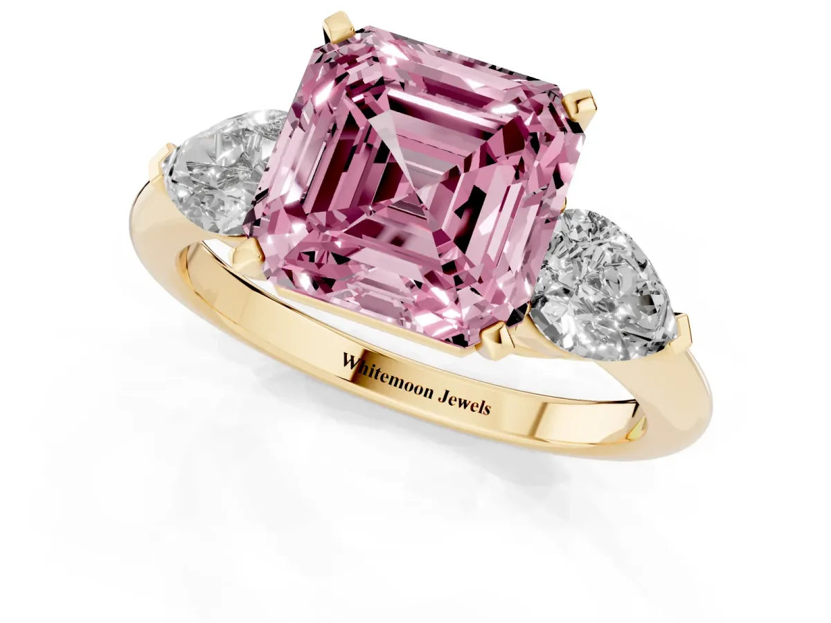 Fancy Pink Three-Stone Asscher Cut Diamond Ring with Pear Side Stones and Four-Prong Setting Yellow gold