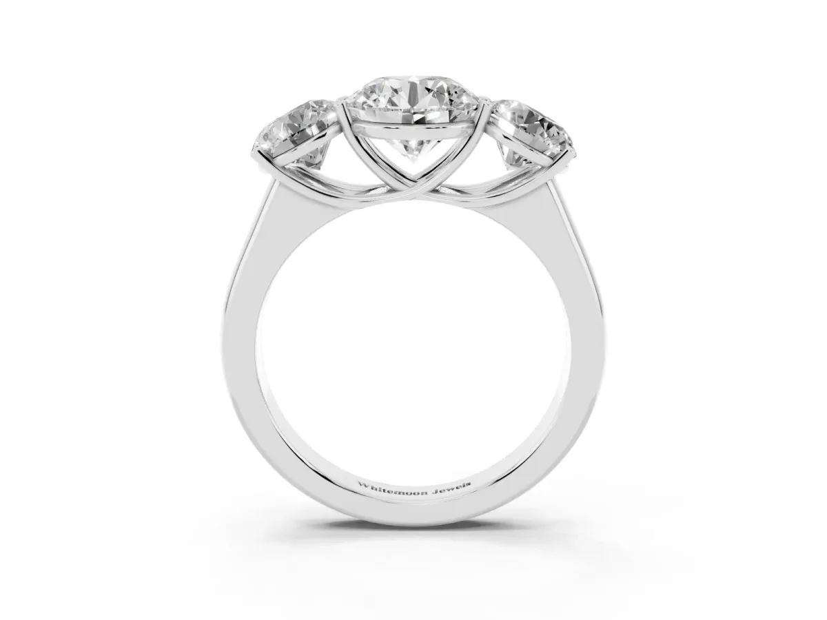Round Cut Three-Stone Diamond Ring with Prong Setting on a Classic Band Platinum