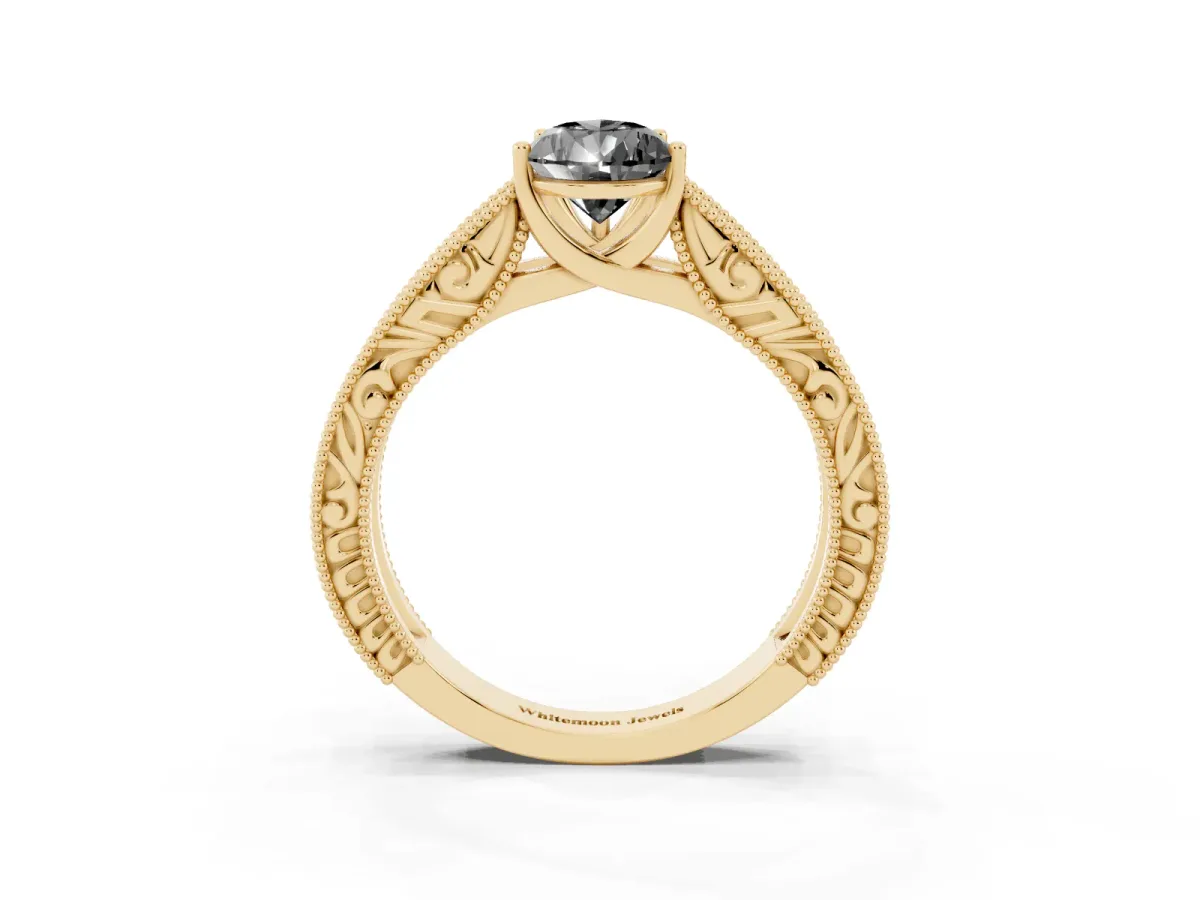 Fancy Black Pear Cut Diamond Solitaire Ring with Engraved Band and Four-Prong Setting Yellow gold