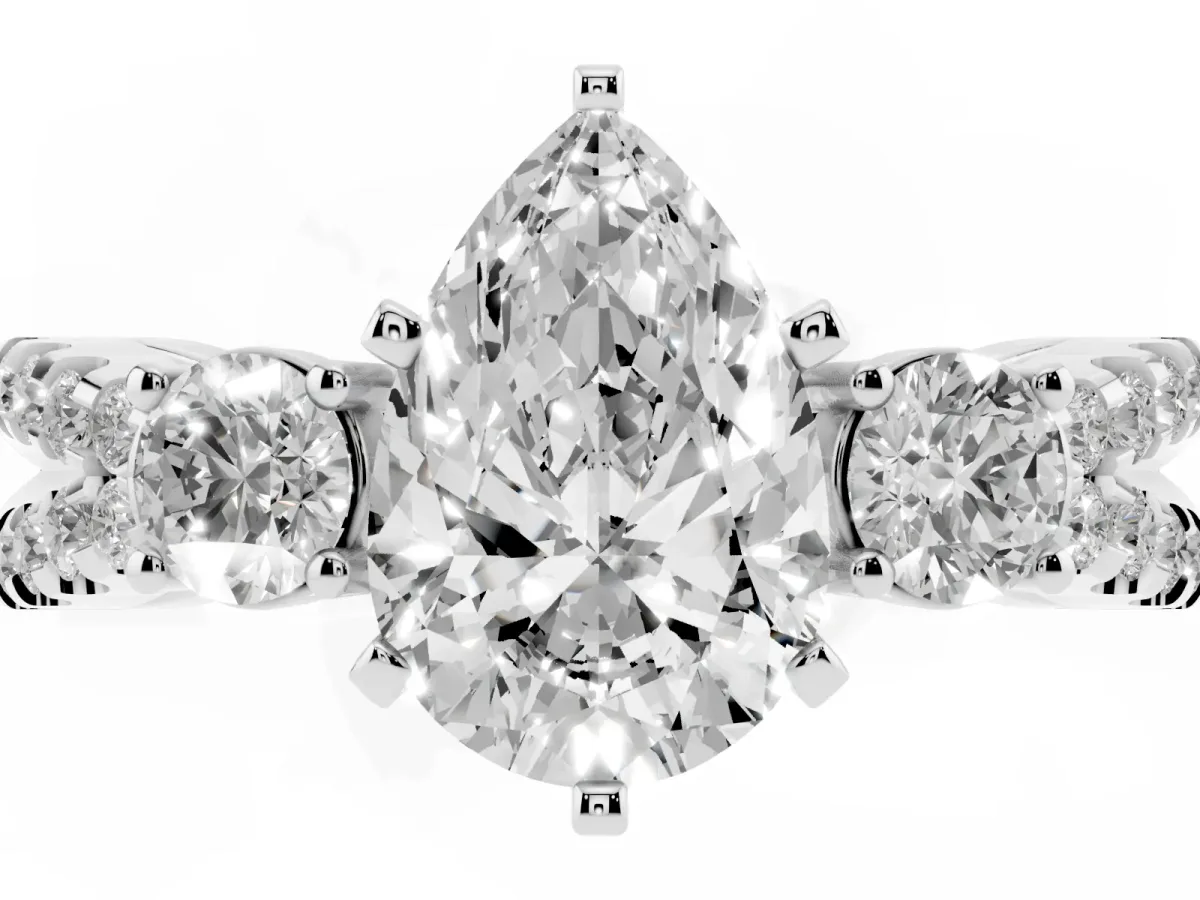 Pear Cut Diamond Three-Stone Ring with Pavé Split Shank and Four-Prong Setting Platinum