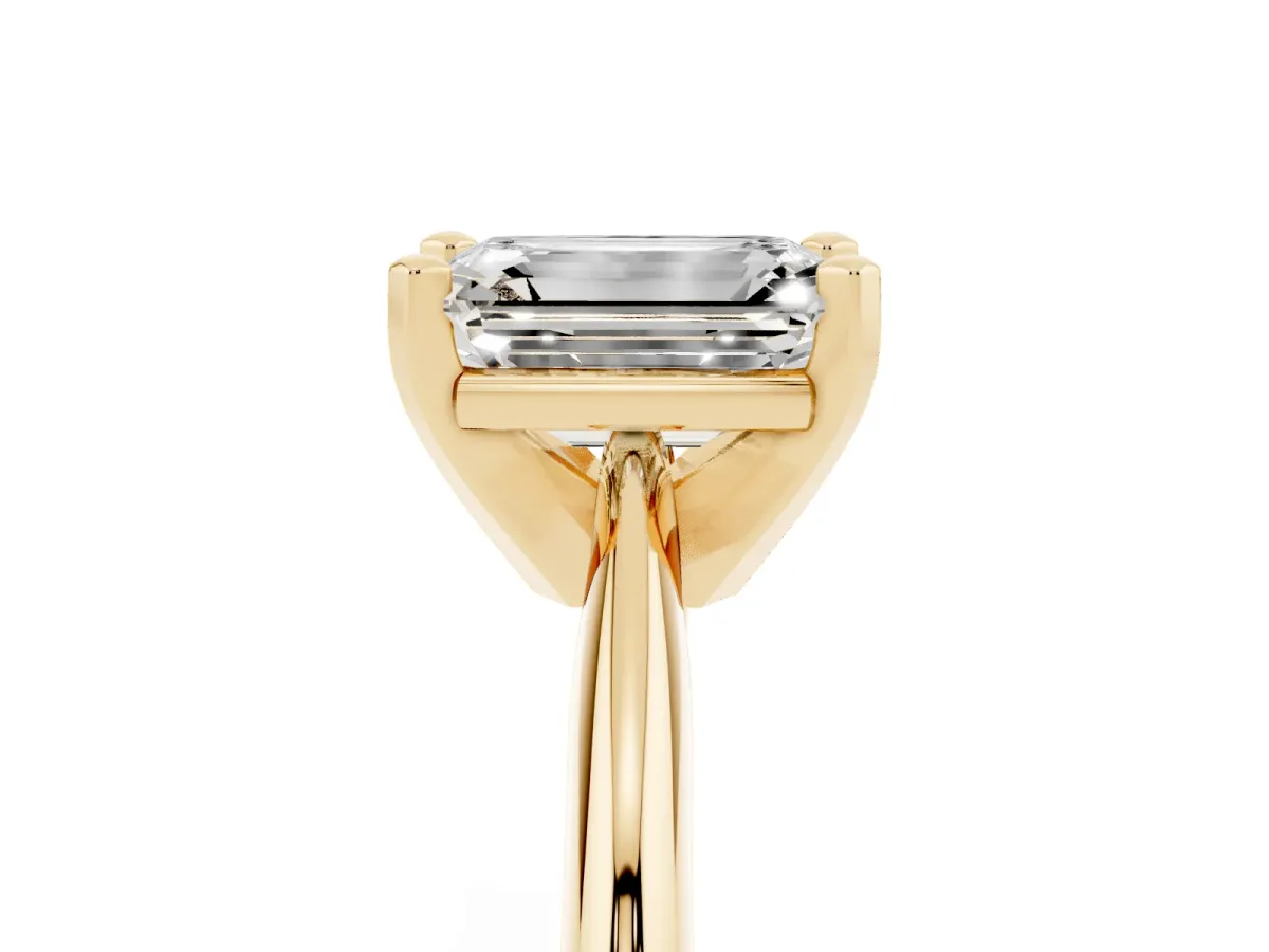 Emerald Cut Cut Solitaire Ring with Four-Prong Setting on a Classic Band Yellow gold