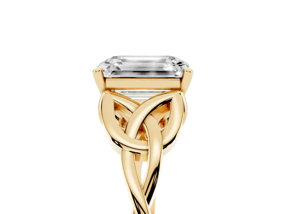 Emerald Cut Diamond Solitaire Engagement Ring with Celtic Knot Band and Four-Prong Setting Yellow gold