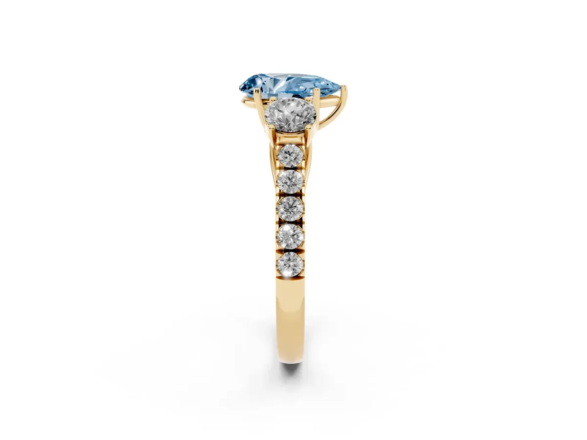 Fancy Blue Pear Cut Cut Diamond Three-Stone Ring with Round Side Stones and Pavé Band Yellow gold