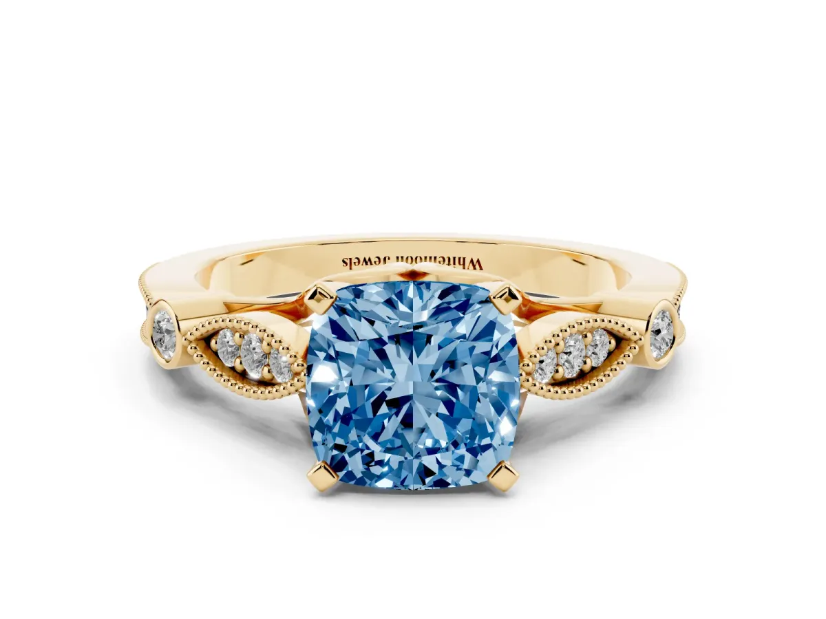 Fancy Blue Cushion Cut Cut Diamond with Milgrain Marquise and Bezel Accents on a Solitaire Band with Prong Setting Yellow gold
