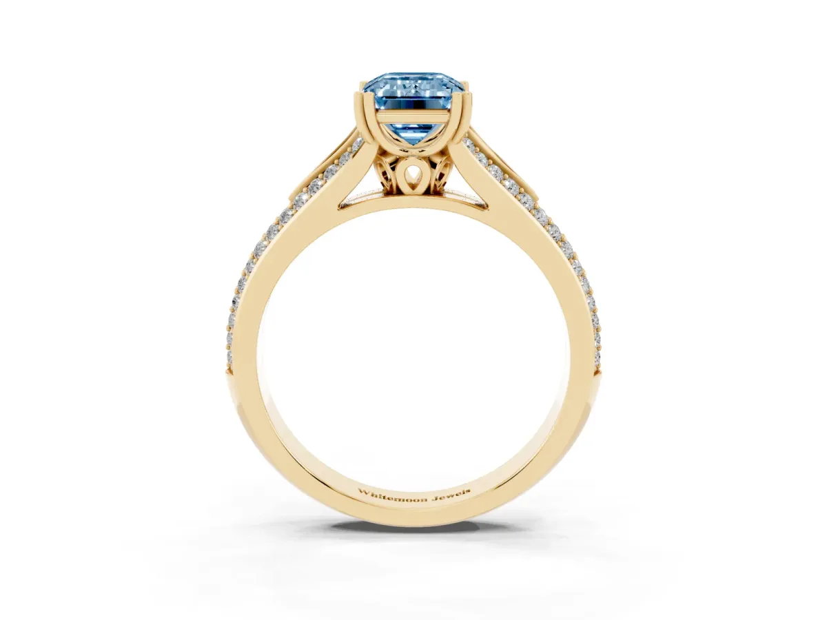 Fancy Blue Emerald Cut Diamond Split Shank Engagement Ring with Pavé Band Yellow gold