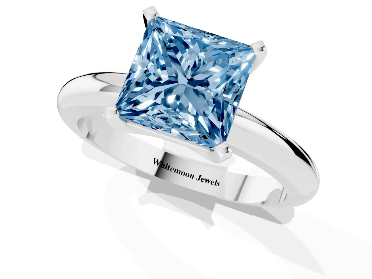 Fancy Blue Princess Cut Diamond Solitaire Engagement Ring with Round Band and Four-Prong Setting Silver