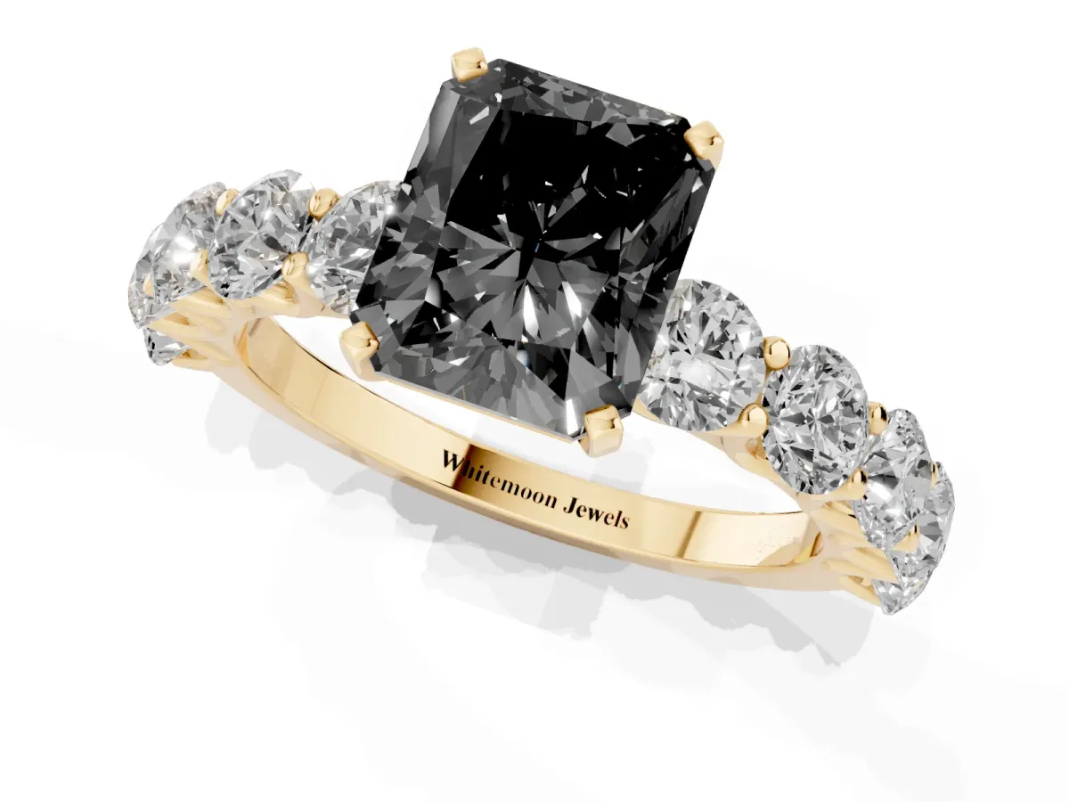 Fancy Black Radiant Cut Diamond Prong Setting with Side Stones on a Pave Band Yellow gold