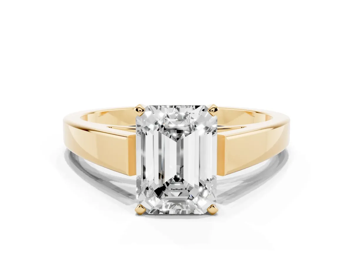 Emerald Cut Solitaire Engagement Ring with Four-Prong Setting and Tapered Band Yellow gold