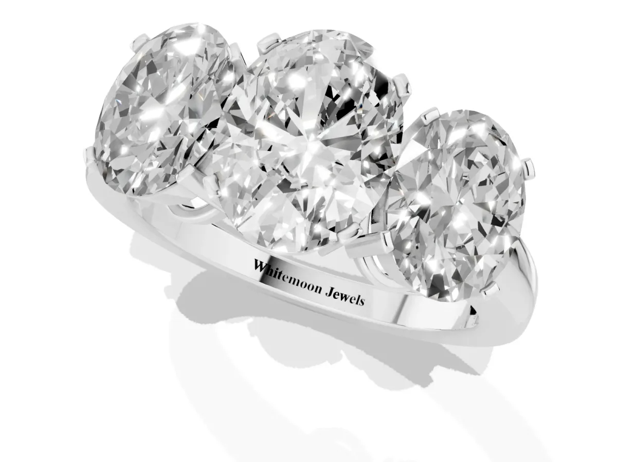 Three-Stone Oval Cut Cut Diamond Ring with Channel Set Band and Four-Prong Setting Silver