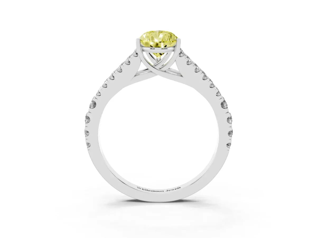 Fancy Yellow Pear Cut Diamond Split Shank Engagement Ring with Round Pavé and Prong Setting Platinum