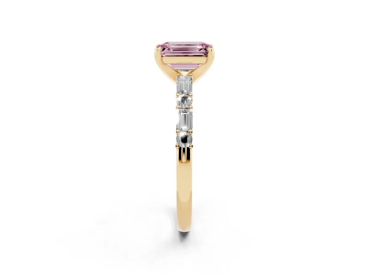 Fancy Pink Emerald Cut Diamond Solitaire with Side Baguettes and Channel Set Band Yellow gold