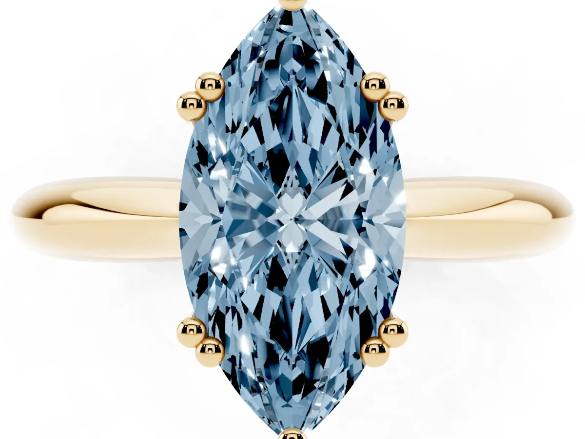 Fancy Blue Marquise Cut Cut Solitaire Engagement Ring with Tapered Band and Four-Prong Setting Yellow gold