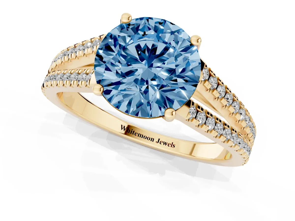 Fancy Blue Round Cut Diamond Solitaire Engagement Ring with Split Shank Pavé Band Yellow gold