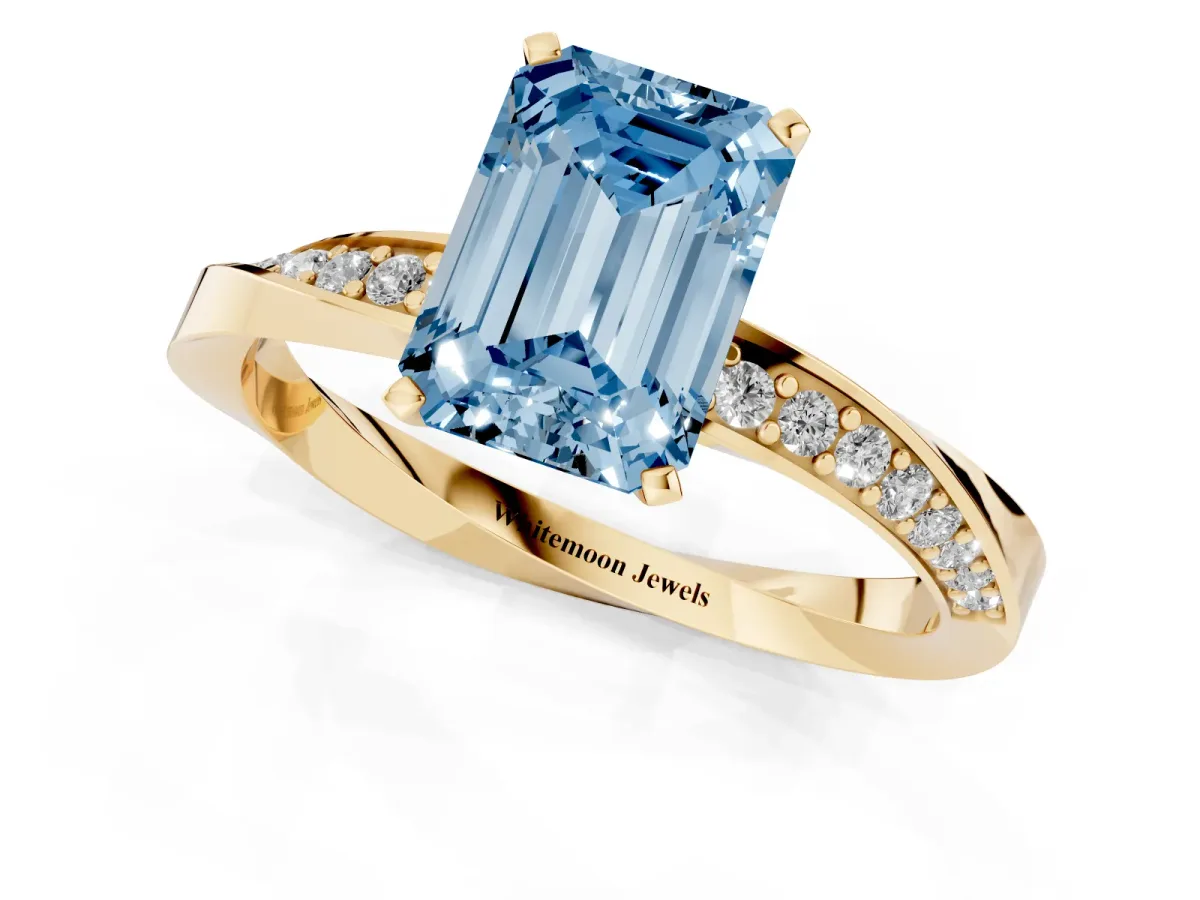 Fancy Blue Emerald Cut Diamond Engagement Ring with Side Stone Accents and Four-Prong Setting Yellow gold