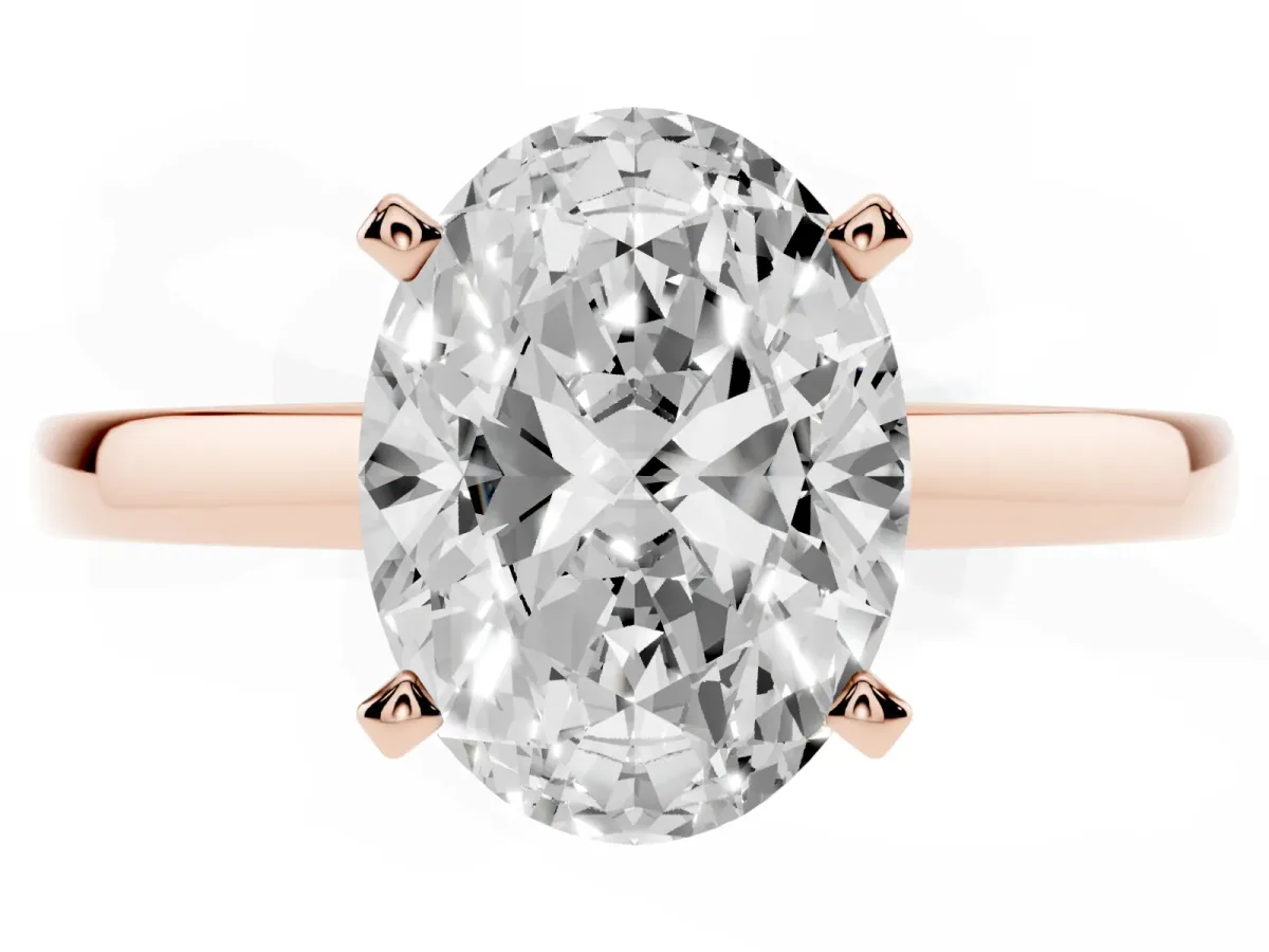 Oval Cut Solitaire Diamond Engagement Ring with Four-Prong Setting on a Classic Band Rose gold