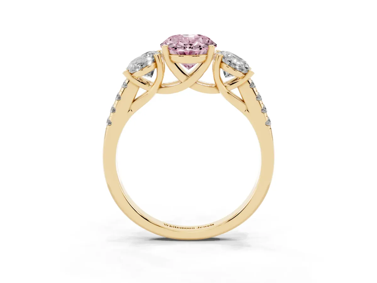 Fancy Pink Three-Stone Oval Cut Diamond Ring with Round Pavé Band and Prong Setting Yellow gold