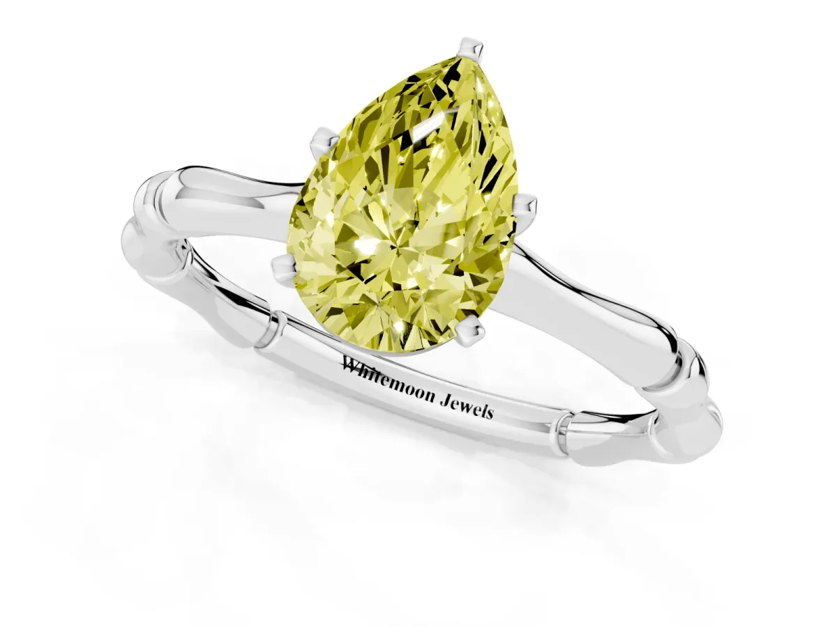 Fancy Yellow Pear Cut Solitaire Diamond Ring with Bamboo Band and Four-Prong Setting Silver