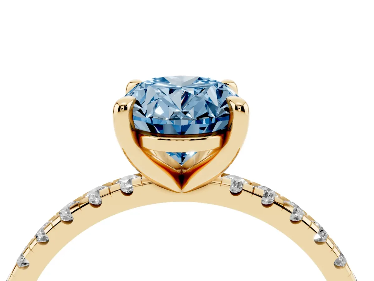 Fancy Blue Oval Cut Diamond Brilliant Solitaire Ring with Pavé Band and Four-Prong Setting Yellow gold