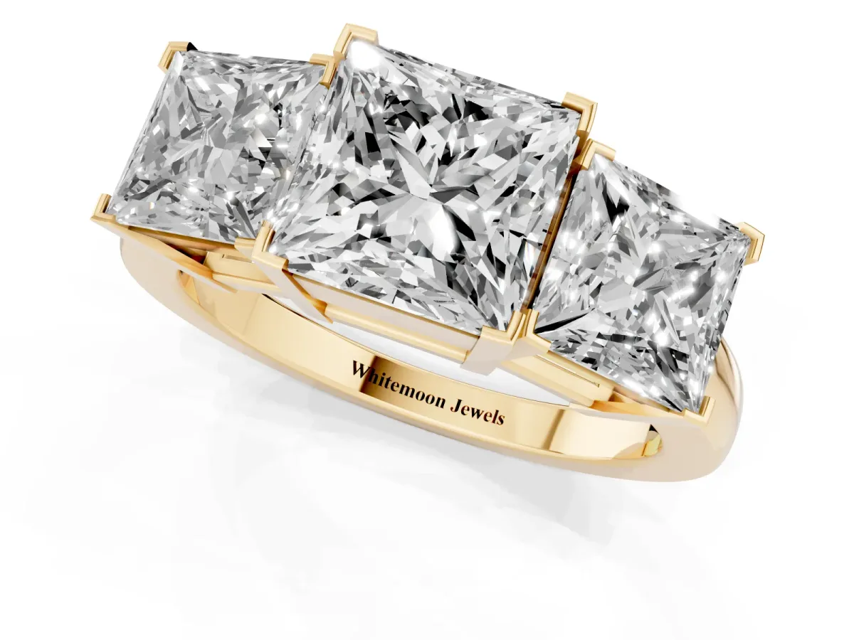Three-Stone Princess Cut Cut Diamond Ring with Channel Set Band and Four-Prong Setting Yellow gold