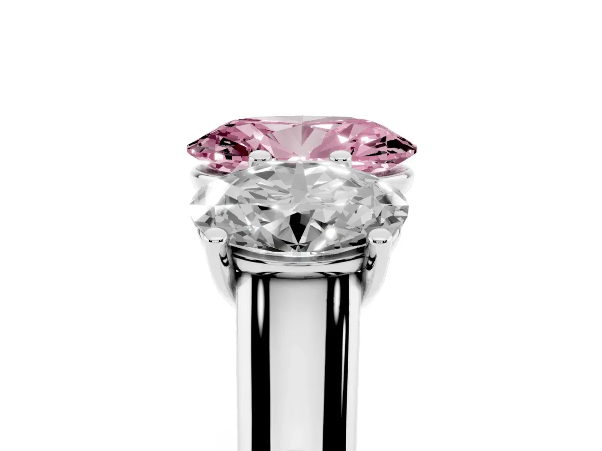 Fancy Pink Oval Cut Three-Stone Diamond Ring with Prong Setting on a Classic Band Platinum