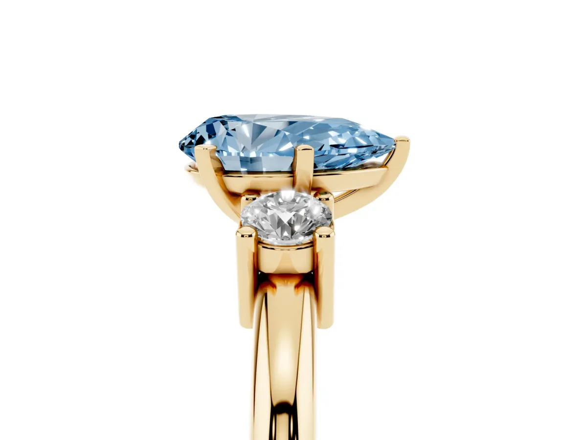 Fancy Blue Three-Stone Pear Cut Cut Diamond Solitaire with Prong Setting and Classic Band Yellow gold