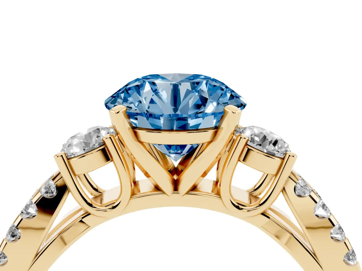 Fancy Blue Round Cut Diamond Three-Stone Ring with Pavé Split Shank and Four-Prong Setting Yellow gold