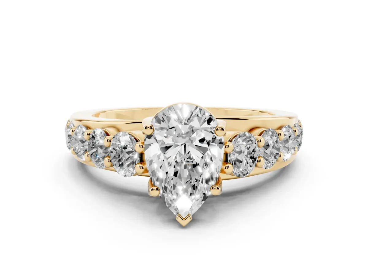 Pear Cut Diamond Engagement Ring with Pavé Band and Four-Prong Setting Yellow gold
