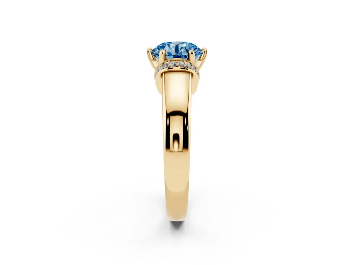 Fancy Blue Round Cut Solitaire Diamond Ring with Pave Band and Six-Prong Setting Yellow gold