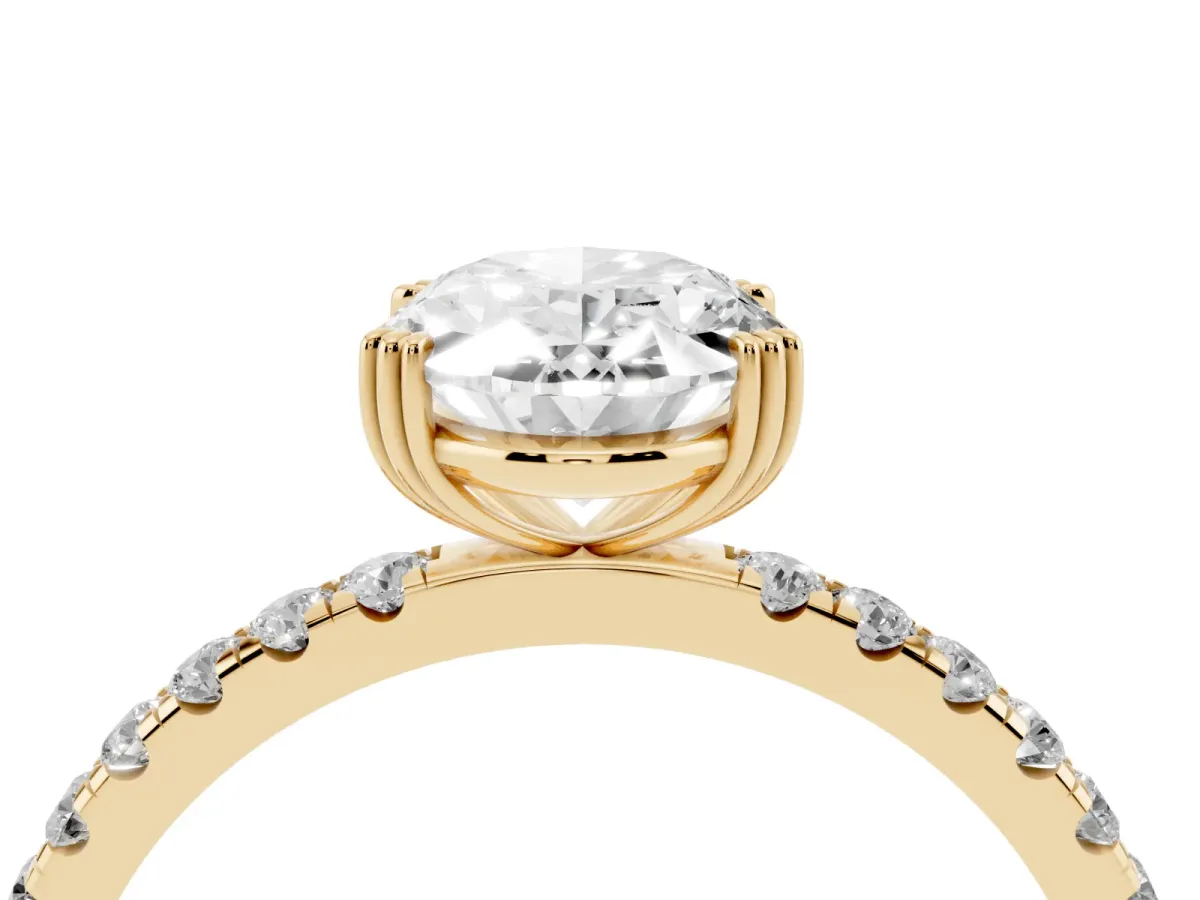 Oval Cut Brilliant Solitaire with Pavé Band and Claw Prong Setting Yellow gold