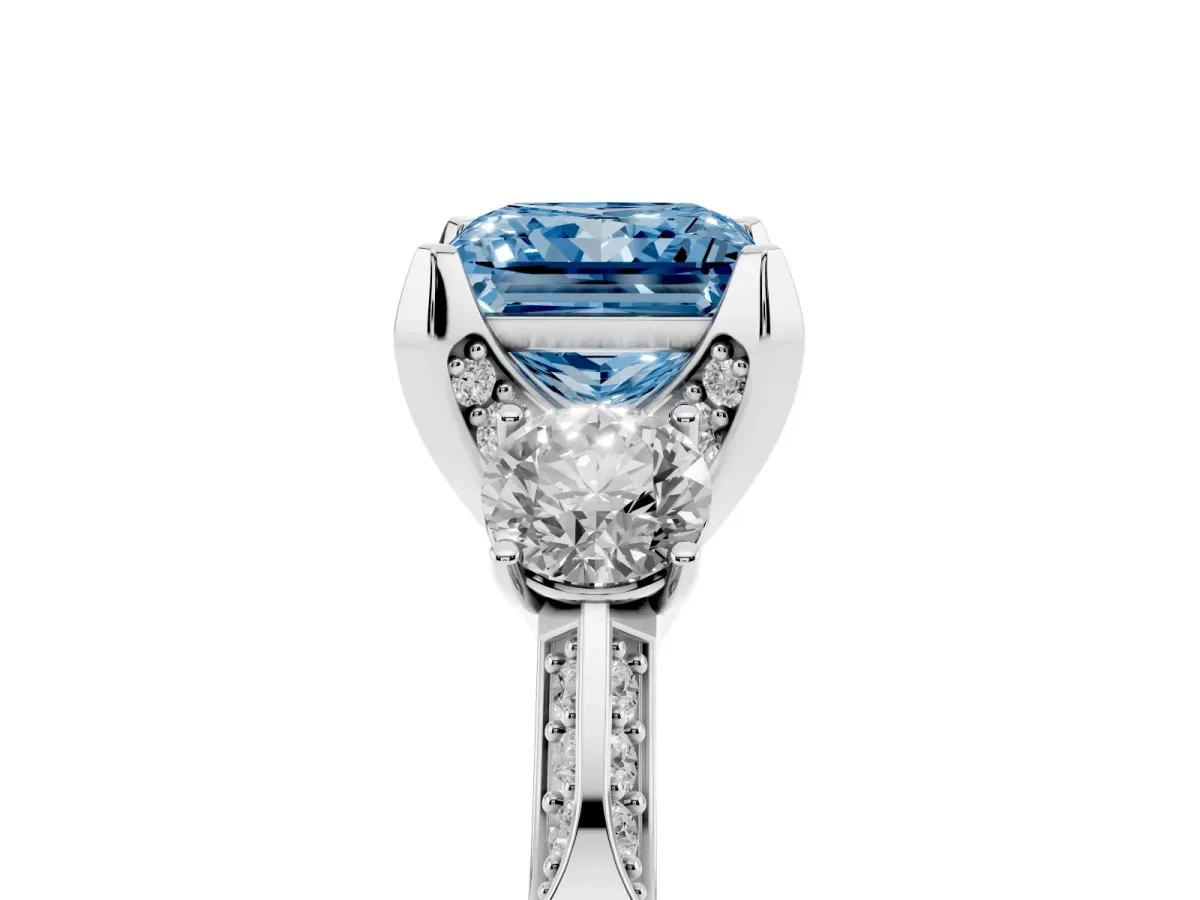 Fancy Blue Princess Cut Brilliant Three-Stone Diamond Ring with Pavé Band and Four-Prong Setting Silver