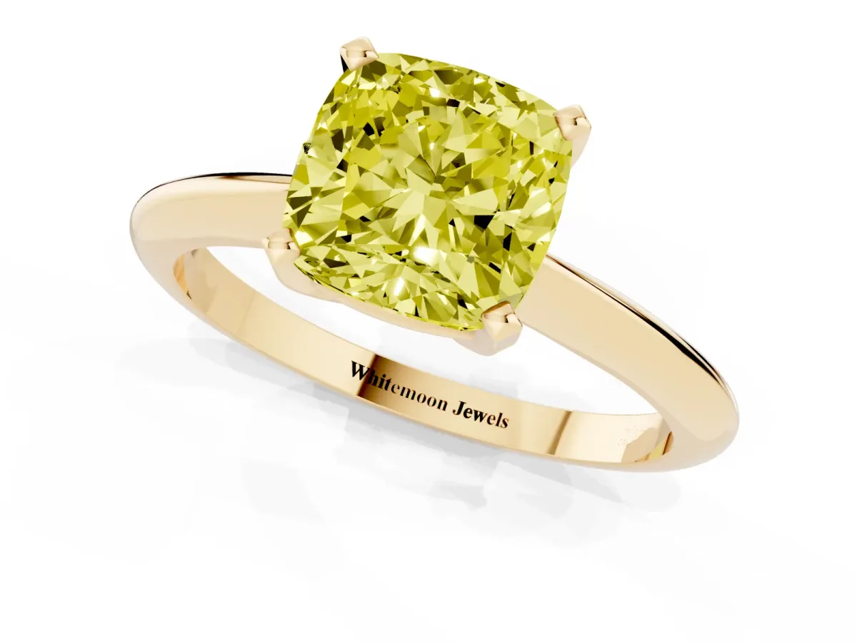 Fancy Yellow Cushion Cut Cut Solitaire Ring with Four-Prong Setting on a Classic Band Yellow gold