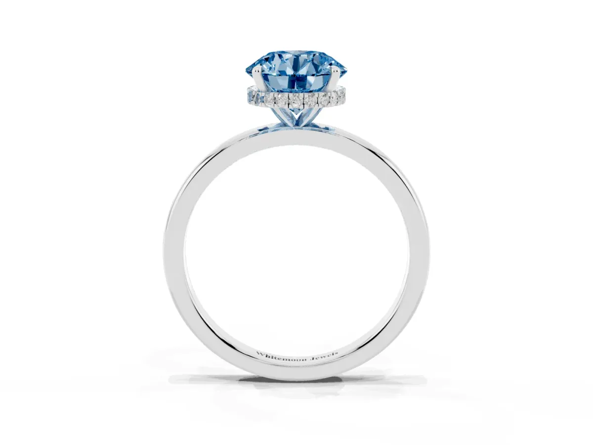 Fancy Blue Round Cut Solitaire Engagement Ring with Cathedral Band and Four-Prong Setting Silver