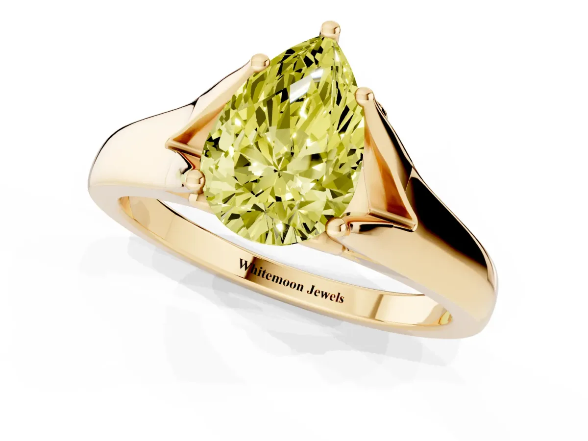 Fancy Yellow Pear Cut Solitaire Diamond Ring with Cathedral Band and Four-Prong Setting Yellow gold
