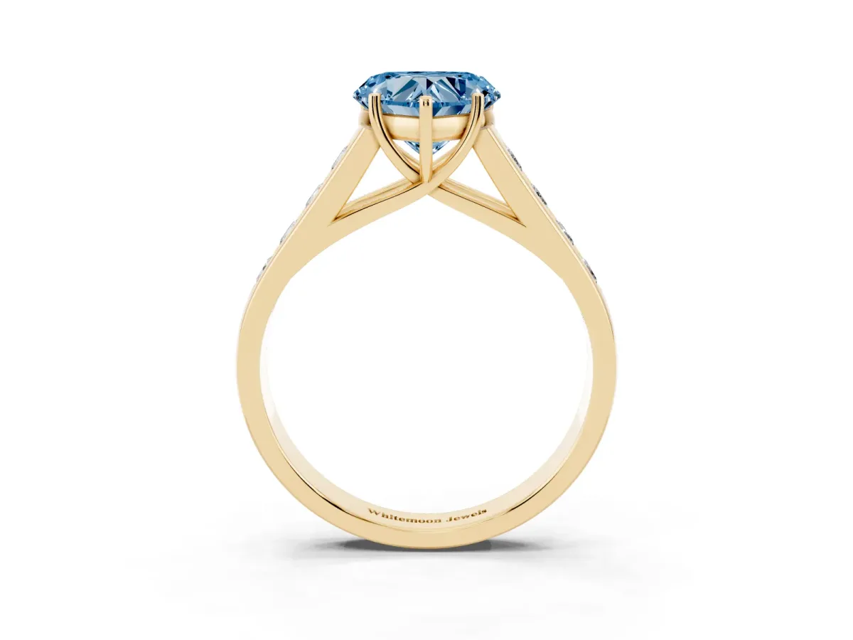 Fancy Blue Heart Cut Brilliant Channel-Set Solitaire Ring with Four-Prong Setting Yellow gold