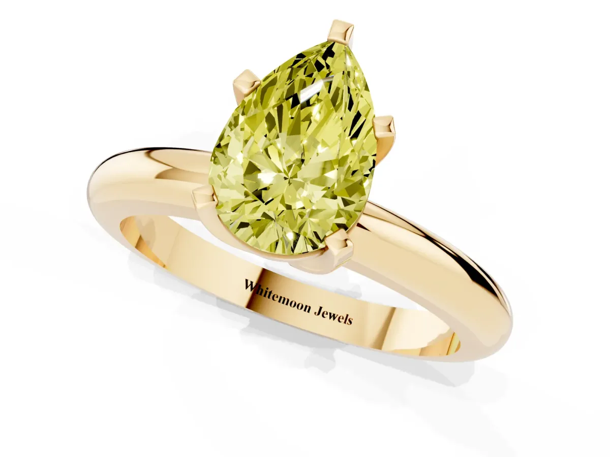 Fancy Yellow Pear Cut Diamond Solitaire Engagement Ring with Round Band and Four-Prong Setting Yellow gold