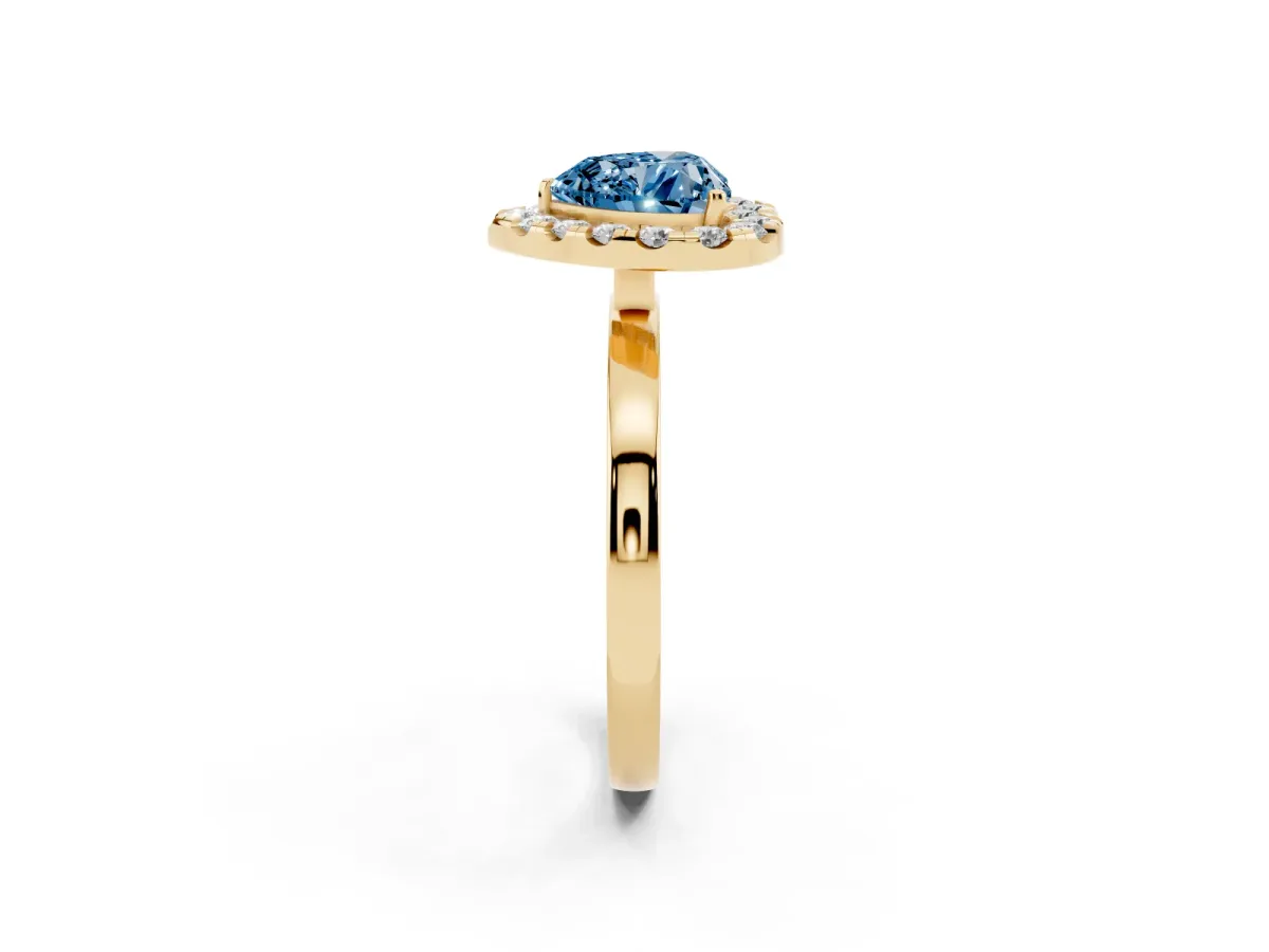 Fancy Blue Heart Cut Halo Diamond Solitaire with Pavé Band and Four-Prong Setting Yellow gold