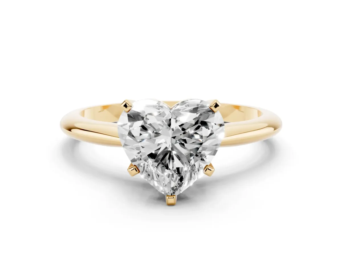 Heart Cut Cut Solitaire Ring with Four-Prong Setting on a Classic Band Yellow gold