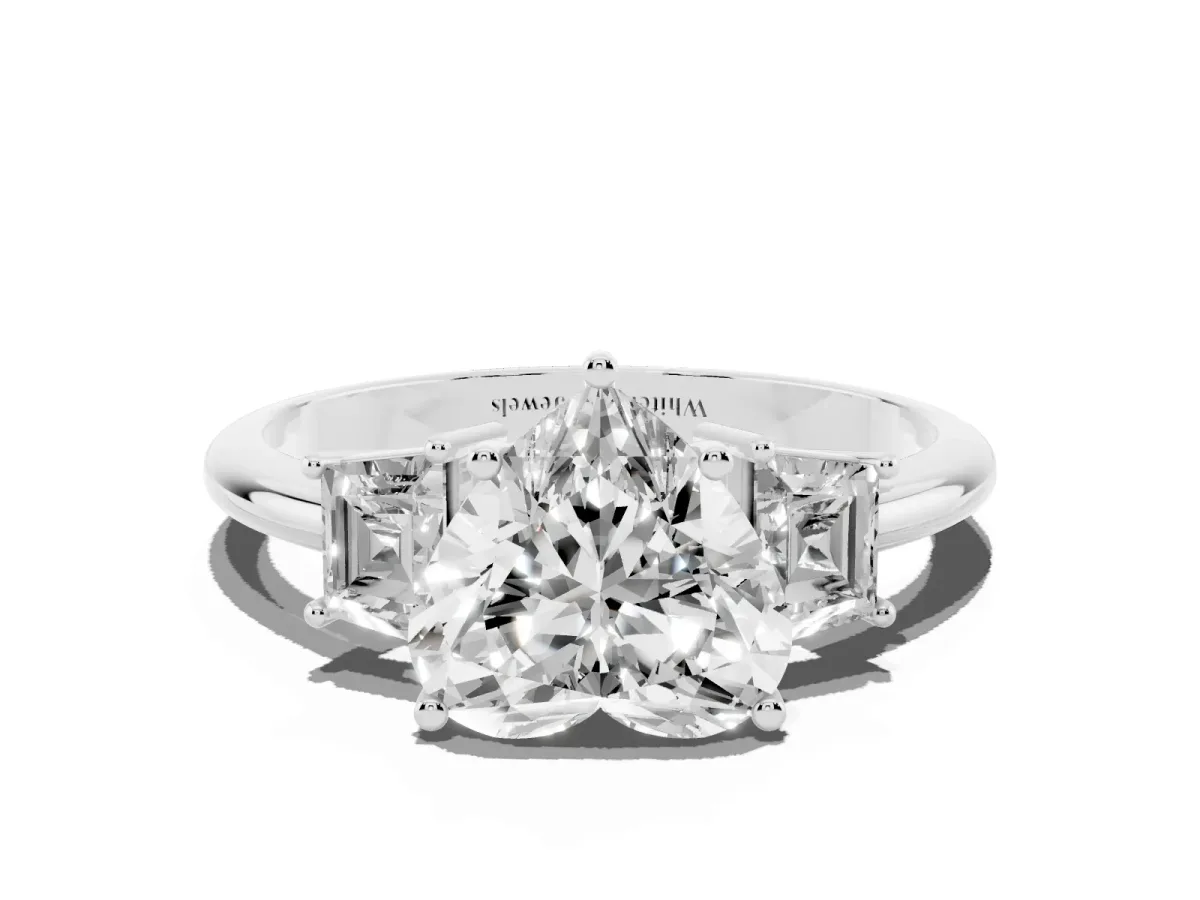 Heart Cut Diamond Three-Stone Ring with Trapezoid Side Stones and Prong Setting Platinum