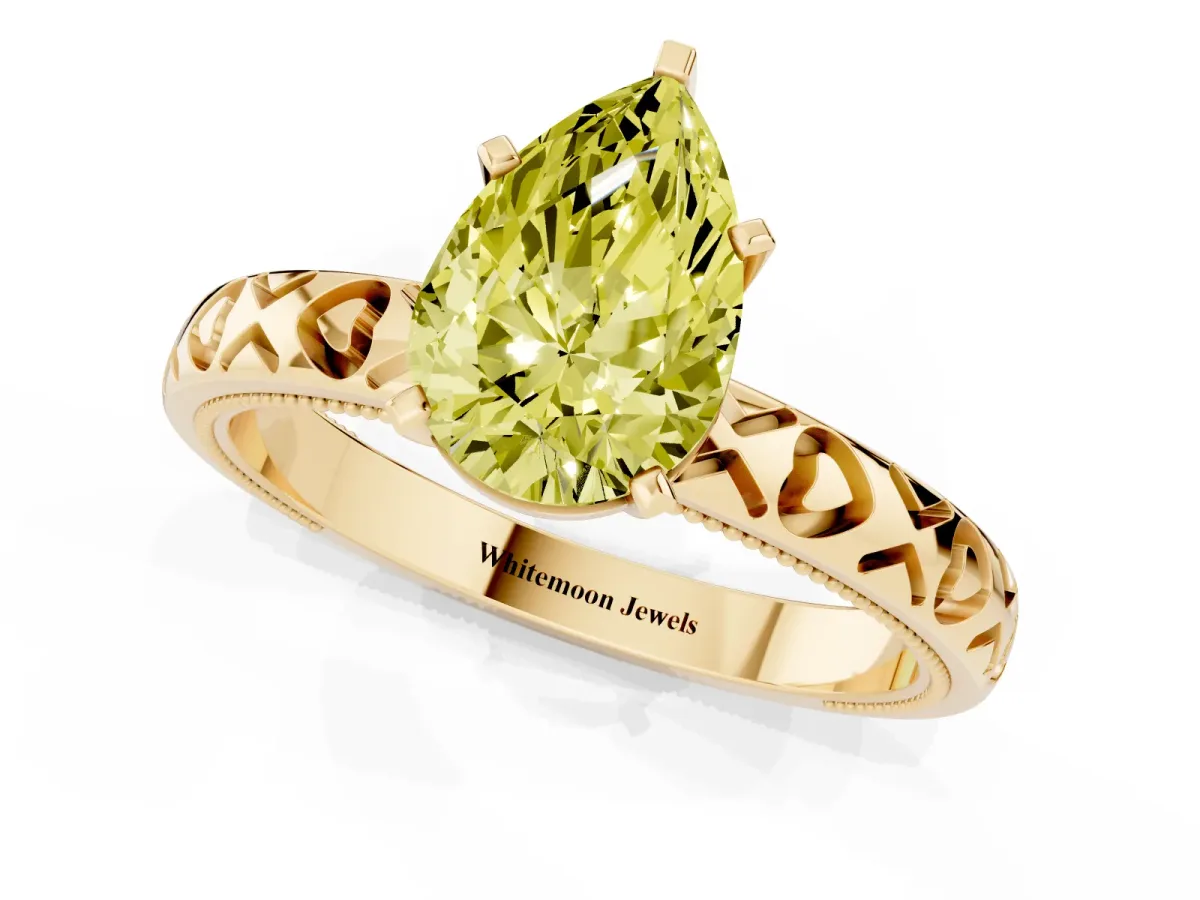 Fancy Yellow Pear Cut Solitaire Diamond Engagement Ring with XO Engraved Band and Four-Prong Setting Yellow gold