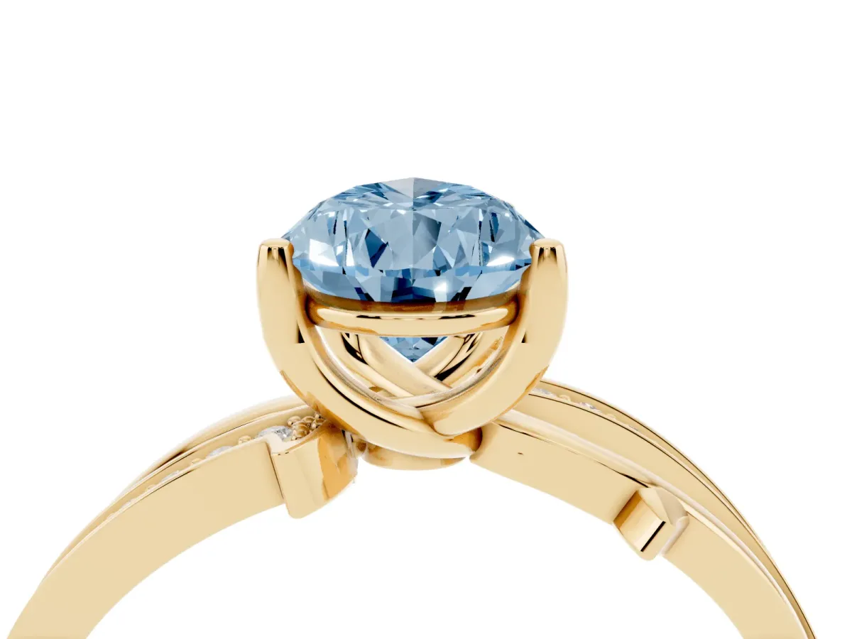 Fancy Blue Pear Cut Solitaire Twist Band with Pavé Accents and Four-Prong Setting Yellow gold