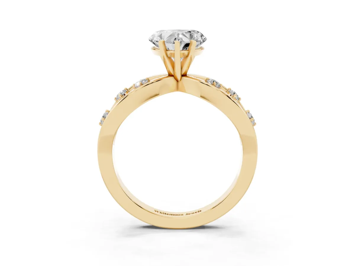 Heart Cut Cut Solitaire Diamond with Side Stones on Criss-Cross Band and Four-Prong Setting Yellow gold