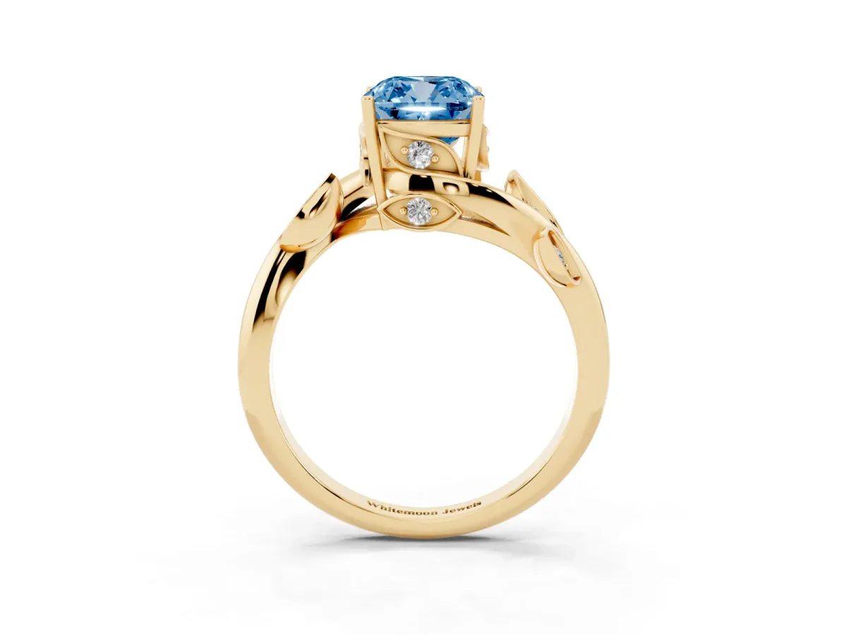 Fancy Blue Cushion Cut Solitaire Twist Engagement Ring with Leaf Accents and Prong Setting Yellow gold