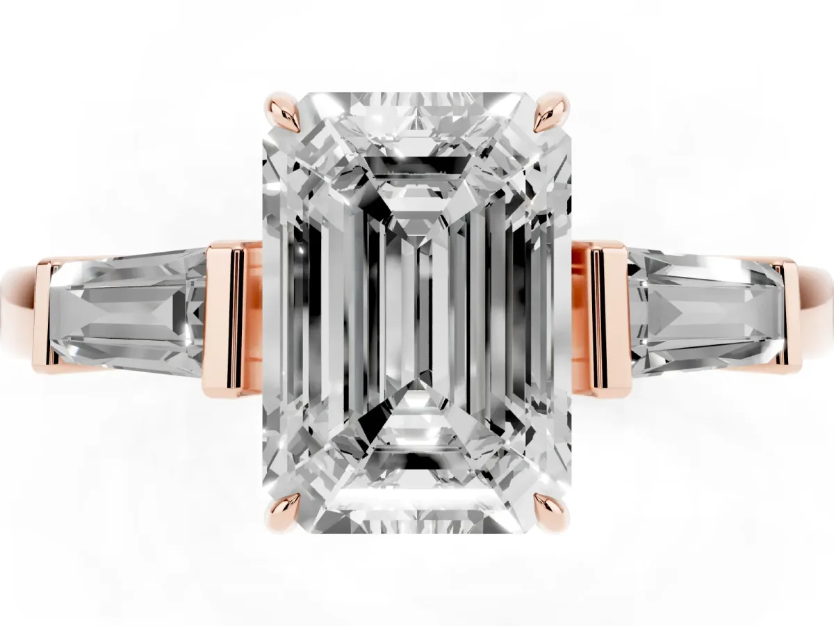 Emerald Cut Diamond Three-Stone Ring with Tapered Baguette Side Stones and Prong Setting Rose gold