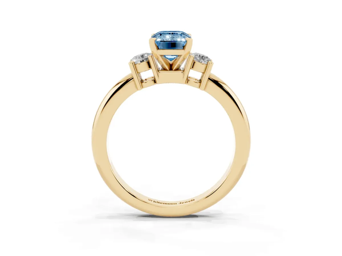 Fancy Blue Three-Stone Emerald Cut Cut Diamond Solitaire with Prong Setting and Classic Band Yellow gold