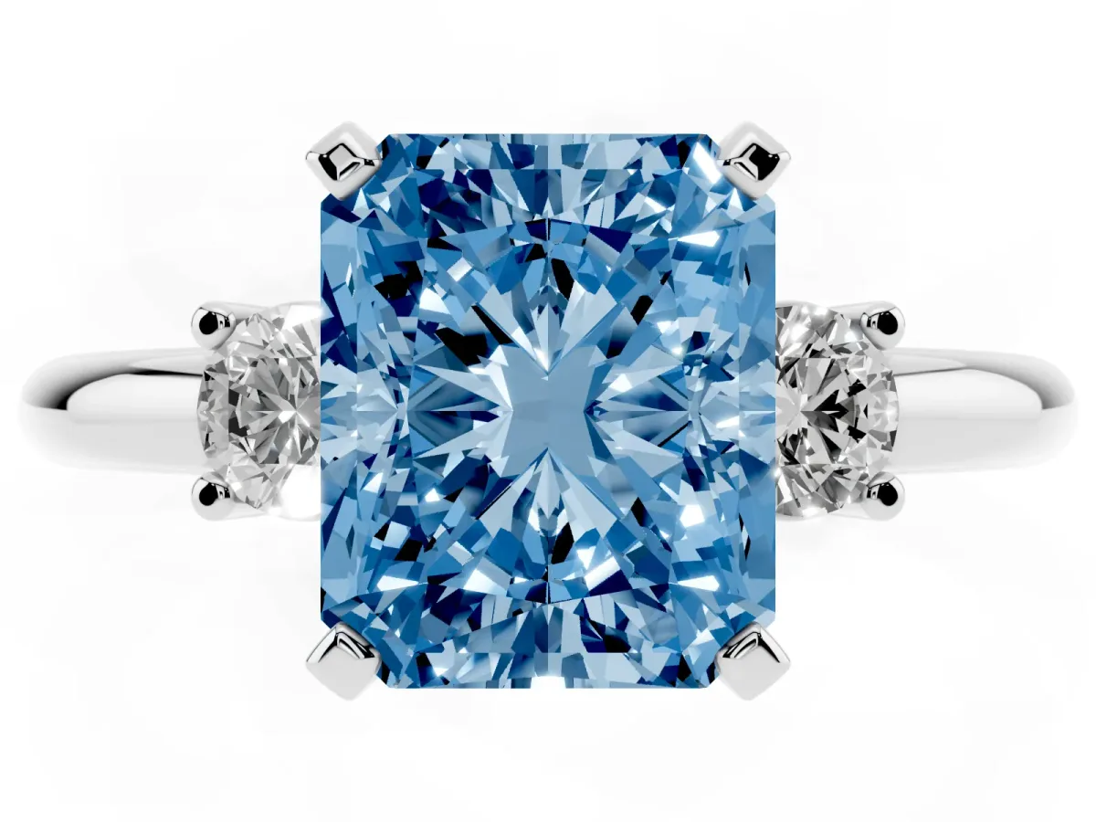 Fancy Blue Three-Stone Radiant Cut Cut Diamond Solitaire with Prong Setting and Classic Band Platinum