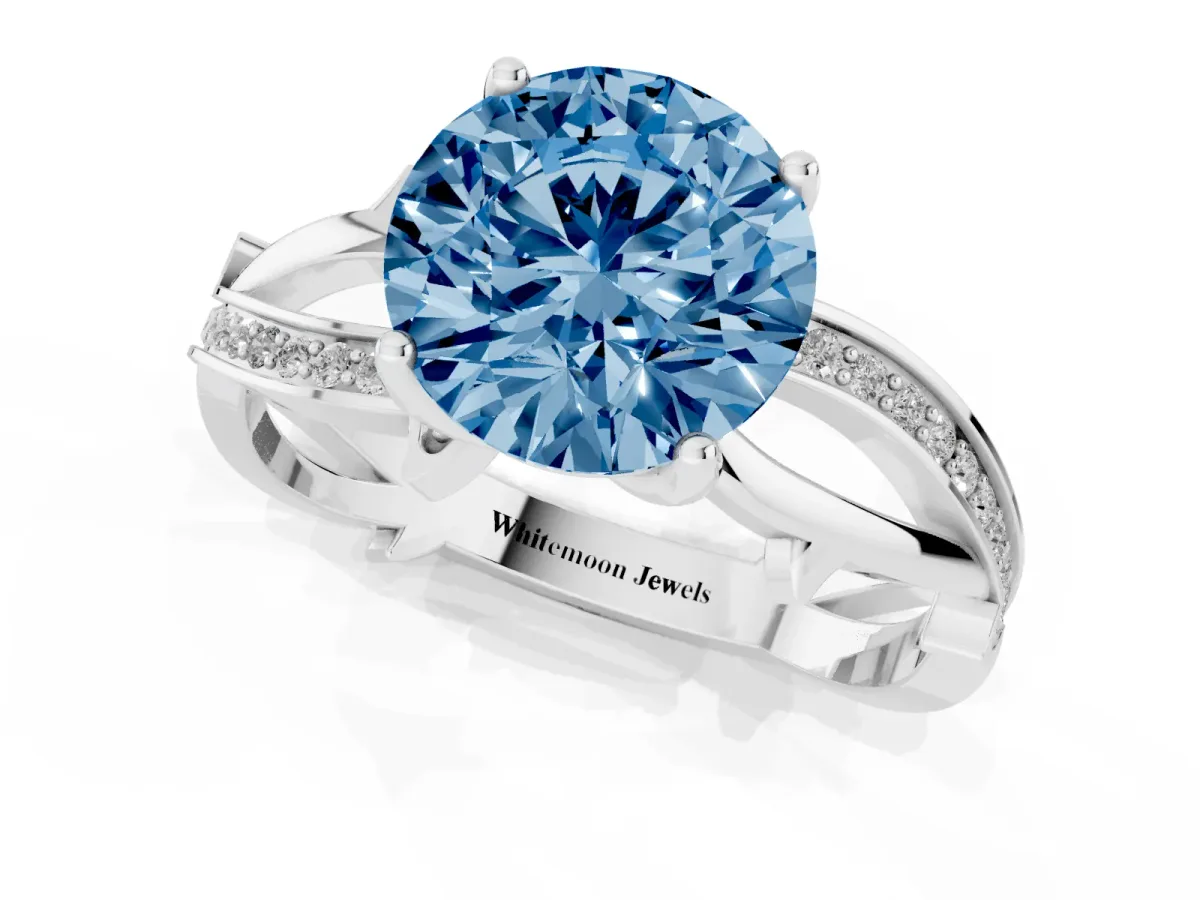 Fancy Blue Round Cut Solitaire Twist Band with Pavé Accents and Four-Prong Setting Platinum